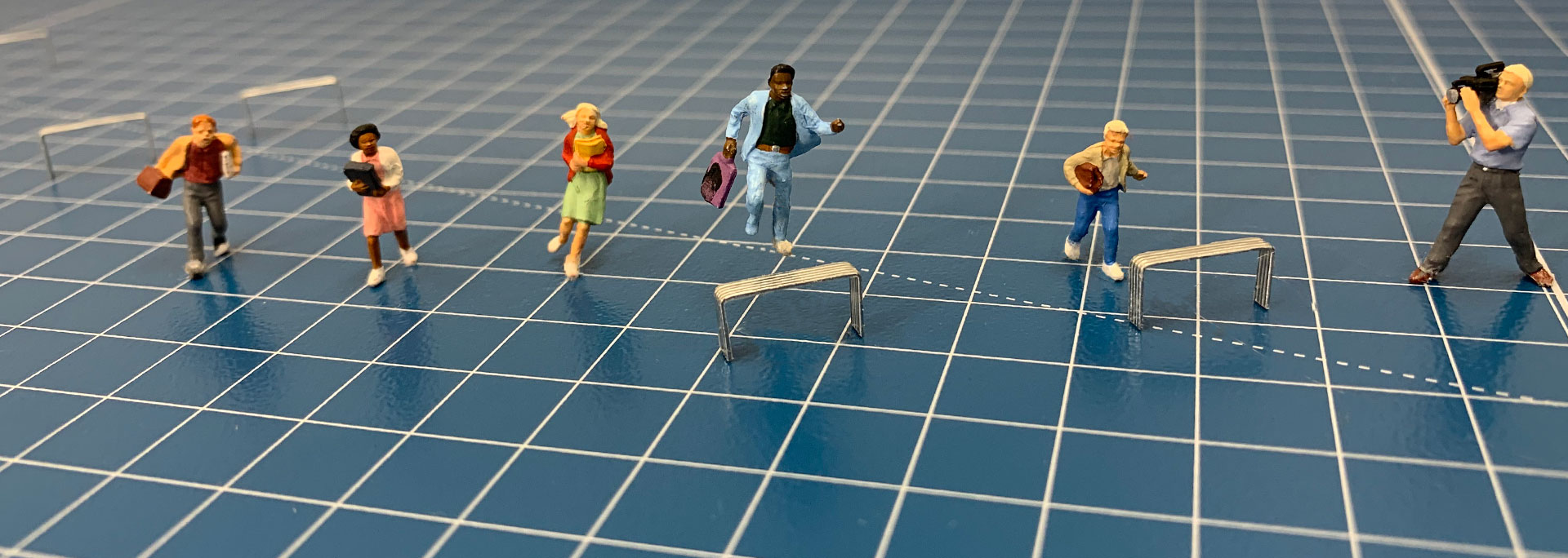 Miniature people running